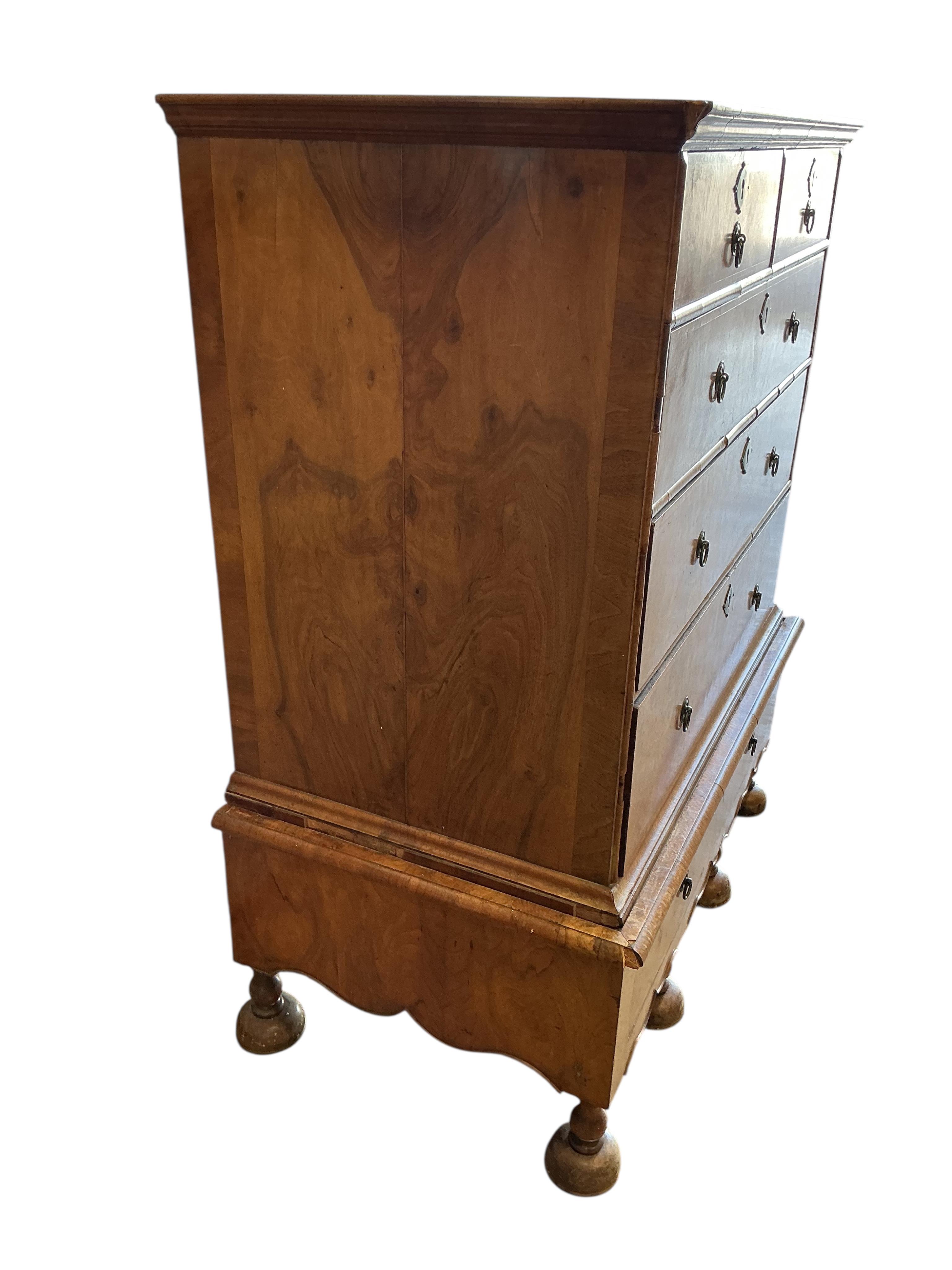 An 18th century style walnut chest on stand, width 108cm, depth 62cm, height 132cm
